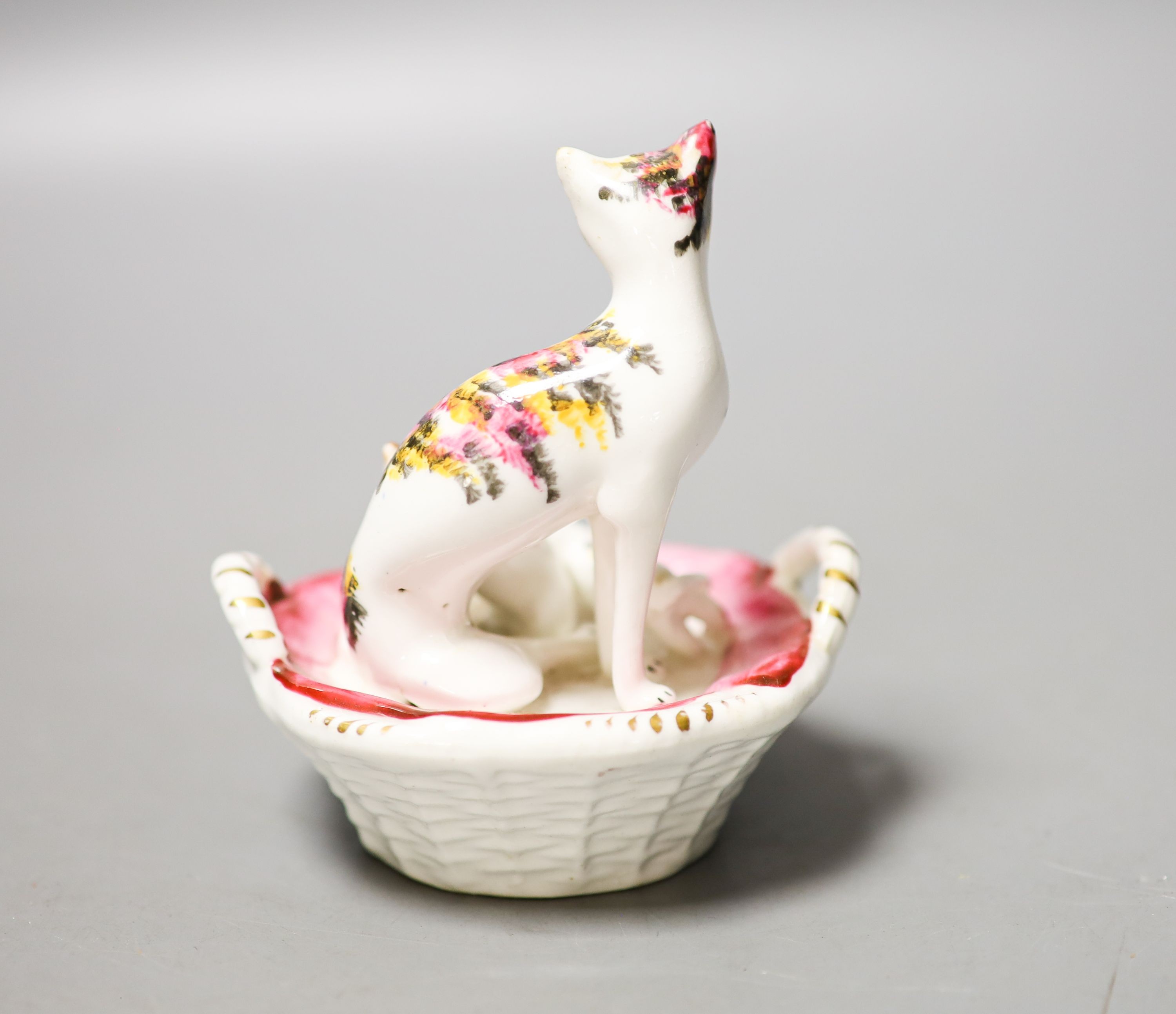 A Staffordshire porcelain group of a cat and kittens in a basket, c.1835-50 10cm